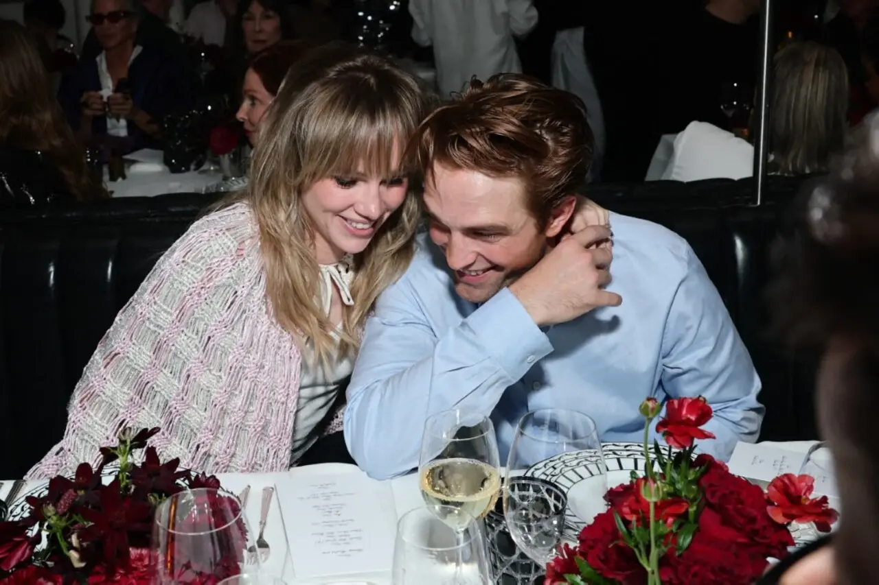Suki Waterhouse and Robert Pattinson were seen getting cosy at the party